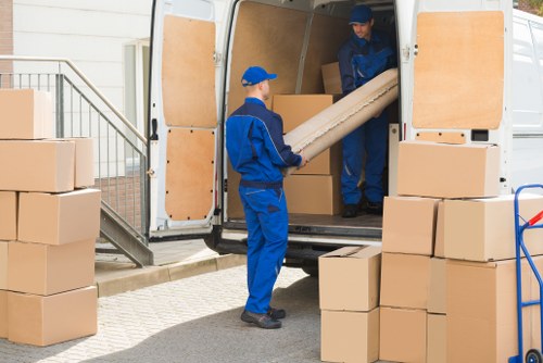Man with a van moving boxes and furniture in Stockwell