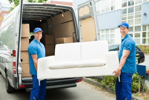 Team safely loading goods into a moving van