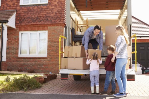 Moving crew handling furniture and household items during a local relocation