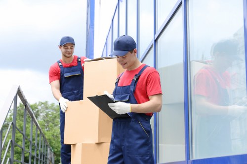 Packed boxes and moving equipment for a Stockwell home relocation