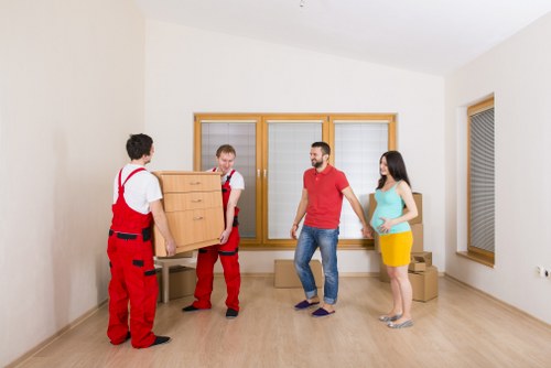 Packed office furniture and boxes ready for a business move in Stockwell