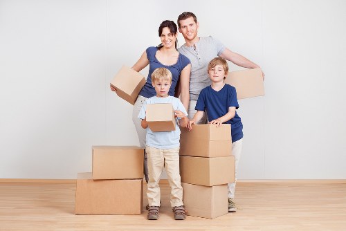 Packed boxes and furniture ready for removal in a Stockwell property