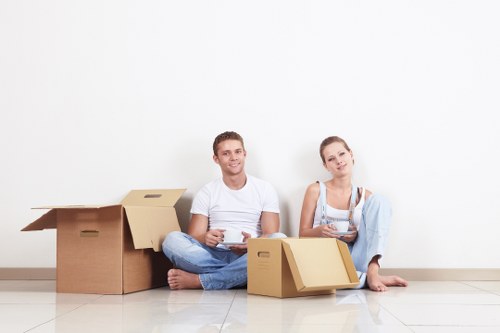Local movers preparing fragile items for a Stockwell relocation