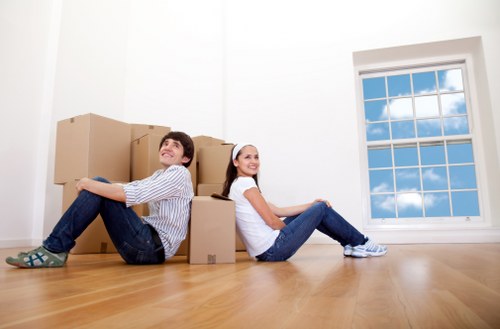 Packed boxes and furniture ready for transport in a Stockwell home move