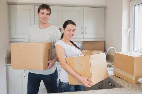 Professional movers handling bulky furniture in Stockwell